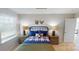 This is a cozy bedroom featuring two wood bedside tables and coordinated bedding with accents at 133 Way Cross Ln, Troutman, NC 28166