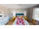 Bright bedroom featuring stylish decor, colorful bedding and ample natural light from large windows at 133 Way Cross Ln, Troutman, NC 28166