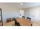 Spacious dining room featuring neutral walls, wood table, and examples of home exterior design choices at 133 Way Cross Ln, Troutman, NC 28166