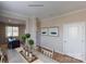 Elegant dining room with neutral walls, framed art, view of staircase and contemporary table set at 133 Way Cross Ln, Troutman, NC 28166