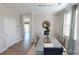 Elegant dining room with neutral walls, decorative mirror, area rug and contemporary table set at 133 Way Cross Ln, Troutman, NC 28166