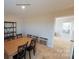 This is a bright dining room that shows design options, including stone, with views into other rooms at 133 Way Cross Ln, Troutman, NC 28166