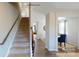 Inviting entryway showcasing hardwood floors, a staircase with wood railings and neutral walls at 133 Way Cross Ln, Troutman, NC 28166