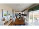 Open concept kitchen with white cabinets, stainless steel appliances, and dining area at 133 Way Cross Ln, Troutman, NC 28166