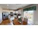 Modern kitchen with a center island, stainless steel appliances, and a view to backyard at 133 Way Cross Ln, Troutman, NC 28166