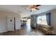 Bright living room featuring modern furniture, a ceiling fan, and lots of natural light at 133 Way Cross Ln, Troutman, NC 28166
