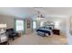 This is a spacious main bedroom featuring large windows, a ceiling fan, and a beautifully coordinated color palette at 133 Way Cross Ln, Troutman, NC 28166