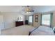 This is a sunlit main bedroom with a high ceiling, large windows, and stylish furnishings at 133 Way Cross Ln, Troutman, NC 28166