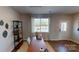 Comfortable office with natural light, hardwood floors, decorative shelves and stylish window at 133 Way Cross Ln, Troutman, NC 28166