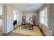 Stylish home office with shelves, desk, bright natural light, and decorative window treatments at 133 Way Cross Ln, Troutman, NC 28166