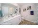 Bathroom with double sinks, tile floor, and decorative art at 136 Mary Locke Way, Statesville, NC 28677