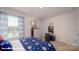 Charming bedroom features a bright window with patterned curtains and neutral carpet at 136 Mary Locke Way, Statesville, NC 28677