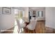 Cozy dining area with a glass table and chairs, next to a bright living space at 136 Mary Locke Way, Statesville, NC 28677