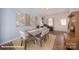 Bright dining space featuring a cozy rug, elegant table setting, and a view of the entryway at 136 Mary Locke Way, Statesville, NC 28677