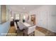 Well-lit dining area with a hardwood floor, modern furniture, and a view of the staircase at 136 Mary Locke Way, Statesville, NC 28677