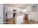 Well-lit kitchen features granite countertops, white cabinets, and stainless steel appliances at 136 Mary Locke Way, Statesville, NC 28677