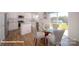 Bright kitchen with modern appliances and an adjacent dining area with a glass table at 136 Mary Locke Way, Statesville, NC 28677