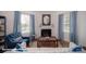 Inviting living room features a cozy fireplace, plush seating, and ample natural light at 136 Mary Locke Way, Statesville, NC 28677