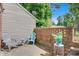 Cozy backyard patio area with brick wall and seating. Includes a small side table at 1485 20Th Ne Ave, Hickory, NC 28601