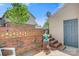 Cozy backyard patio area with brick wall, seating and steps leading to garage door at 1485 20Th Ne Ave, Hickory, NC 28601