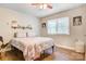 Bedroom with a ceiling fan, window, and laminate floors, with a queen bed at 1485 20Th Ne Ave, Hickory, NC 28601