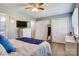 Comfortable bedroom with ceiling fan, white dresser, and closet storage at 1485 20Th Ne Ave, Hickory, NC 28601