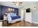 Comfortable bedroom featuring modern decor, ample natural light, and sleek wood flooring at 1485 20Th Ne Ave, Hickory, NC 28601