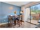 Charming dining area with seating for four and sliding glass doors to an outdoor patio at 1485 20Th Ne Ave, Hickory, NC 28601