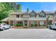 Townhome exterior featuring brick accents, red shutters, and a well-maintained parking area in daytime at 1485 20Th Ne Ave, Hickory, NC 28601