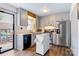 Bright kitchen with gray cabinets, stainless steel appliances, and a functional rolling island for extra prep space at 1485 20Th Ne Ave, Hickory, NC 28601
