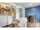 Dining area with laundry closet, featuring a table, chairs, island, and washing machine for easy living at 1485 20Th Ne Ave, Hickory, NC 28601