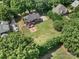 Aerial view of home showing a large yard, back patio, and mature trees creating a private setting at 1498 Farrow Dr, Rock Hill, SC 29732