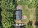 Aerial view showcases home with spacious yard, mature trees, deck and a private driveway at 1498 Farrow Dr, Rock Hill, SC 29732