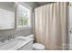 Clean bathroom with a marble countertop vanity, and a window that provides natural light at 1498 Farrow Dr, Rock Hill, SC 29732