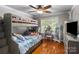 bedroom with a bunk bed, hardwood floors and a vanity with mirror at 1498 Farrow Dr, Rock Hill, SC 29732