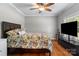 Comfortable bedroom features hardwood floors, neutral walls, and a view to the outdoors at 1498 Farrow Dr, Rock Hill, SC 29732