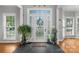 Bright foyer with hardwood floors, transom windows, and decorative accents creating a warm welcome at 1498 Farrow Dr, Rock Hill, SC 29732