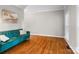 Cozy living room with hardwood floors, a teal sofa, and bright natural light at 1498 Farrow Dr, Rock Hill, SC 29732