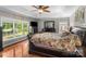 Spacious primary bedroom features hardwood floors, tray ceilings, and large windows at 1498 Farrow Dr, Rock Hill, SC 29732