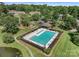 Aerial view of the community pool with lounging area, tables and manicured landscaping at 1498 Farrow Dr, Rock Hill, SC 29732