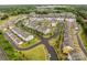 Community aerial showcasing landscaped streets and uniform townhome architecture at 15021 Meacham Farm Dr, Huntersville, NC 28078