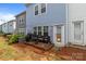 Charming backyard featuring a patio with outdoor seating and string lights at 15021 Meacham Farm Dr, Huntersville, NC 28078