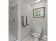 Well-lit bathroom with glass shower, toilet, and decorative wall art at 15021 Meacham Farm Dr, Huntersville, NC 28078