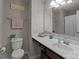 Neutral-toned bathroom featuring a vanity with ample counter space and a framed mirror at 15021 Meacham Farm Dr, Huntersville, NC 28078