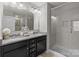 Modern bathroom featuring dual sinks, granite countertop and glass shower at 15021 Meacham Farm Dr, Huntersville, NC 28078