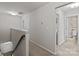 Upstairs hallway leading to bedrooms and bathrooms, with a carpeted floor at 15021 Meacham Farm Dr, Huntersville, NC 28078