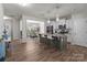Open kitchen with island seating, modern appliances, and seamless flow into the dining area, great for entertaining guests at 15021 Meacham Farm Dr, Huntersville, NC 28078