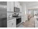 Well-equipped kitchen featuring stainless steel appliances, granite countertops and view of a living space at 15021 Meacham Farm Dr, Huntersville, NC 28078