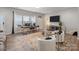 Comfortable living area with a desk, TV, modern furnishings, and neutral decor at 15021 Meacham Farm Dr, Huntersville, NC 28078
