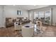 Cozy living room featuring a large sofa, modern decor, and plenty of natural light at 15021 Meacham Farm Dr, Huntersville, NC 28078